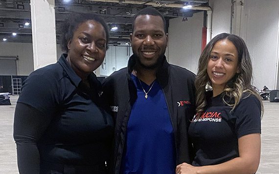 Krucial team members standing next to each other in a shelter facility while smiling